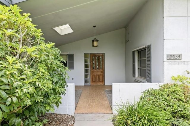 2035 Nolan Dr, Dunedin, FL 34698 - view of exterior entry with stucco siding