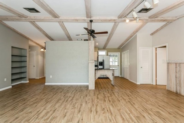 2035 Nolan Dr, Dunedin, FL 34698 - unfurnished living room with light wood-type flooring and ceiling fan