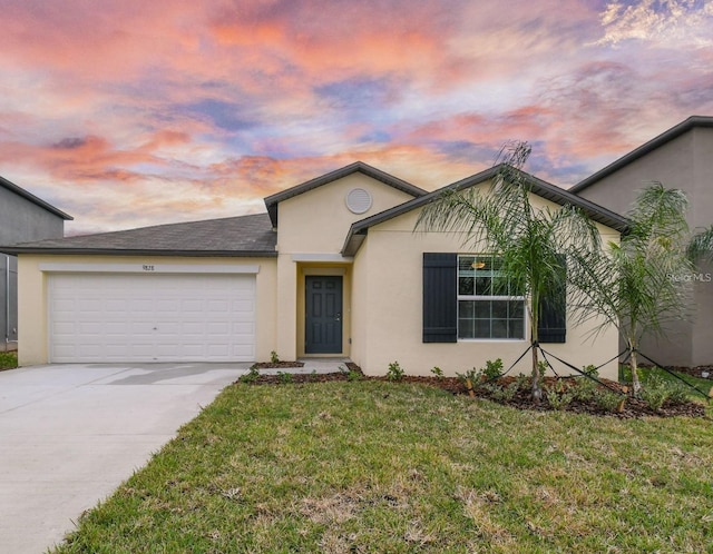 9828 Branching Ship Trce, Wesley Chapel, FL 33545 - view of front of home with a garage, driveway, a front yard, and stucco siding