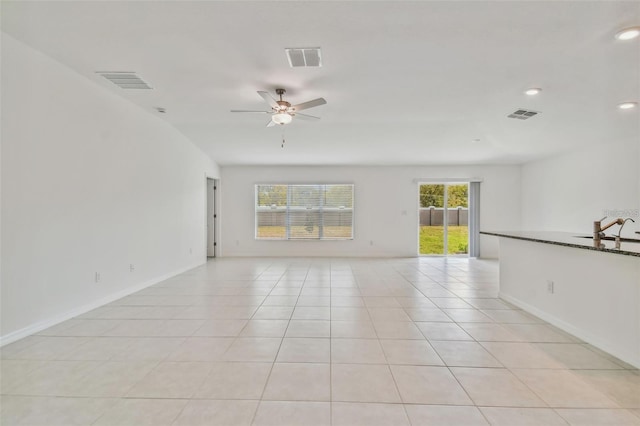 9828 Branching Ship Trce, Wesley Chapel, FL 33545 - spare room with light tile patterned floors, ceiling fan, baseboards, recessed lighting, and a sink
