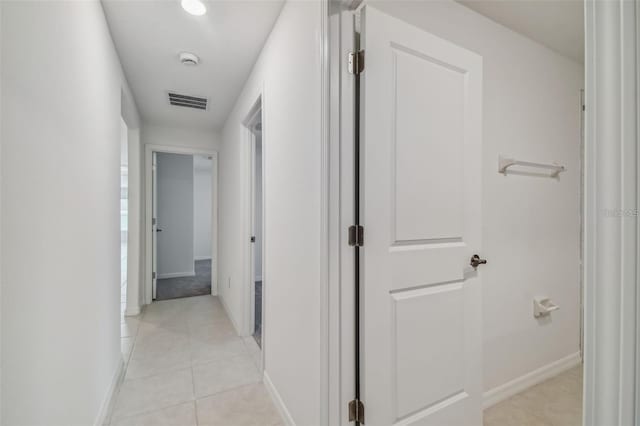 9828 Branching Ship Trce, Wesley Chapel, FL 33545 - corridor featuring light tile patterned floors and baseboards