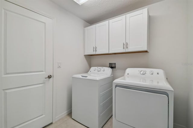 9828 Branching Ship Trce, Wesley Chapel, FL 33545 - laundry area featuring cabinet space, independent washer and dryer, and a textured ceiling