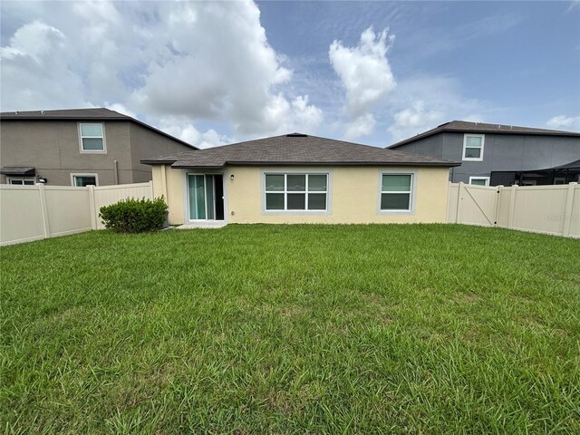 9828 Branching Ship Trce, Wesley Chapel, FL 33545 - rear view of property featuring stucco siding