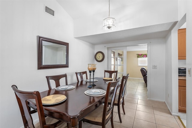 10213 Westport Ct, Tampa, FL 33615 - dining room with light tile patterned floors and baseboards