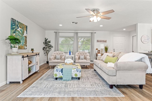 3956 N Tamarisk Pt, Beverly Hills, FL 34465 - living room with wood finished floors, a ceiling fan, baseboards, and recessed lighting