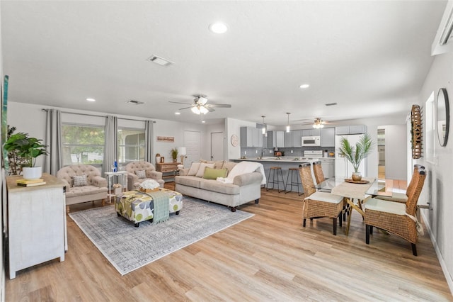 3956 N Tamarisk Pt, Beverly Hills, FL 34465 - living room with ceiling fan, recessed lighting, and light wood-style flooring