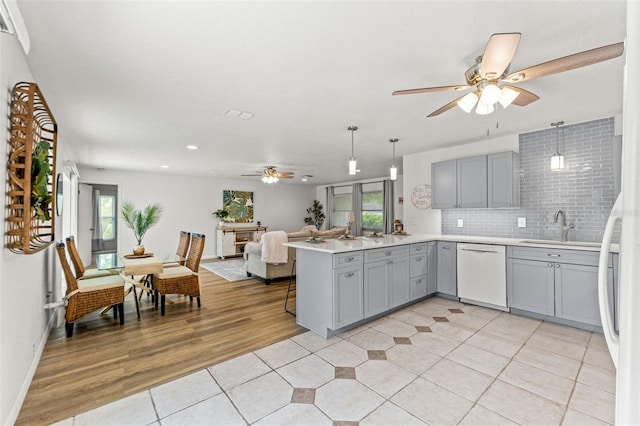 3956 N Tamarisk Pt, Beverly Hills, FL 34465 - kitchen featuring dishwasher, gray cabinetry, ceiling fan, a sink, and a peninsula