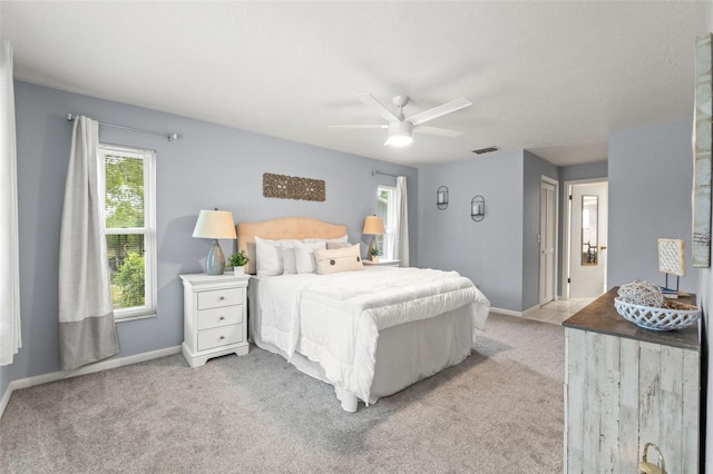 3956 N Tamarisk Pt, Beverly Hills, FL 34465 - bedroom featuring light colored carpet, baseboards, and ceiling fan