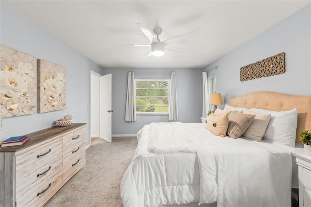 3956 N Tamarisk Pt, Beverly Hills, FL 34465 - bedroom featuring light colored carpet, baseboards, and a ceiling fan