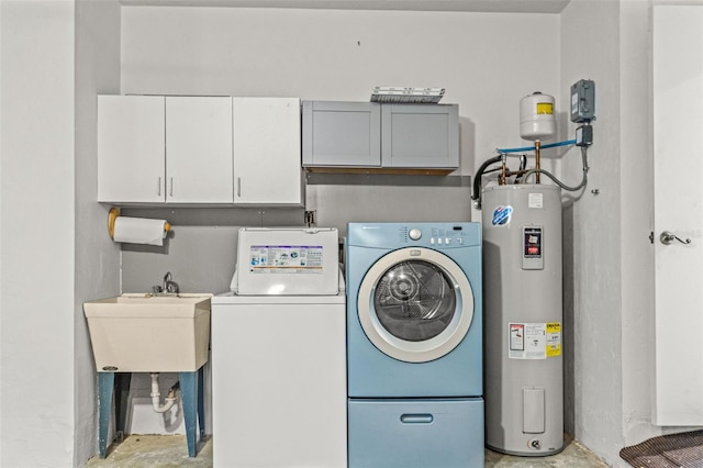 3956 N Tamarisk Pt, Beverly Hills, FL 34465 - washroom with water heater, washing machine and clothes dryer, and cabinet space