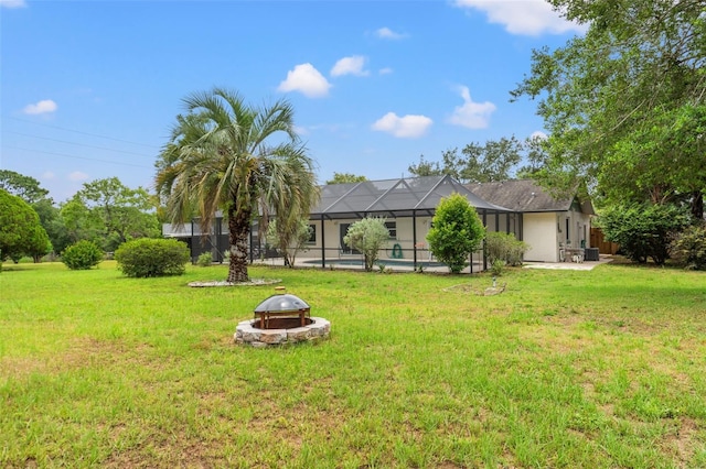 3956 N Tamarisk Pt, Beverly Hills, FL 34465 - view of green lawn featuring a fire pit, a swimming pool, and a patio