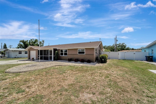 260 Venice E Blvd, Venice, FL 34293 - rear view of house featuring brick siding, a garage, a sunroom, and driveway