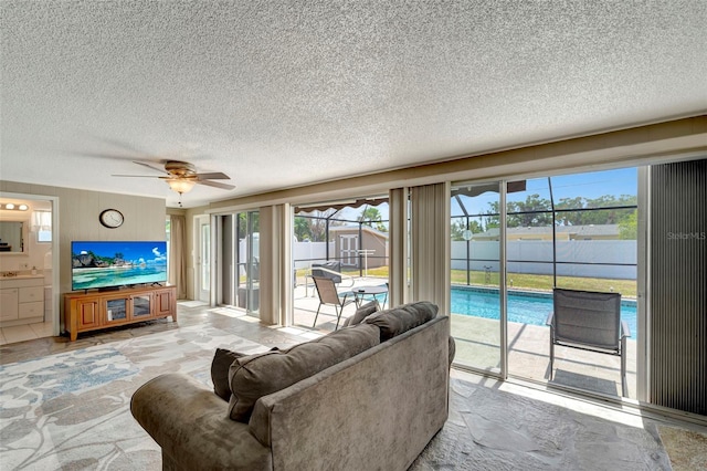 260 Venice E Blvd, Venice, FL 34293 - living room with a textured ceiling and a ceiling fan