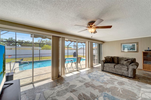 260 Venice E Blvd, Venice, FL 34293 - living area featuring ceiling fan, a textured ceiling, and a water view