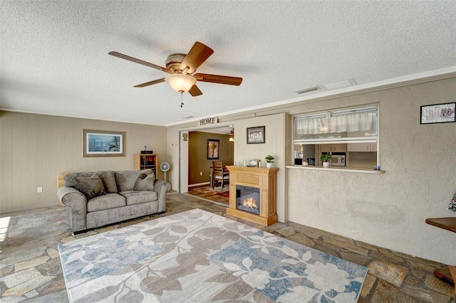 260 Venice E Blvd, Venice, FL 34293 - living room featuring a textured ceiling and a ceiling fan