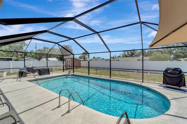 260 Venice E Blvd, Venice, FL 34293 - view of swimming pool featuring a patio, a fenced backyard, a grill, and a lanai