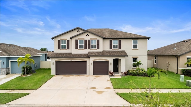 11719 Tetrafin Dr, Riverview, FL 33579 - view of front of home with stucco siding, driveway, an attached garage, and a front lawn