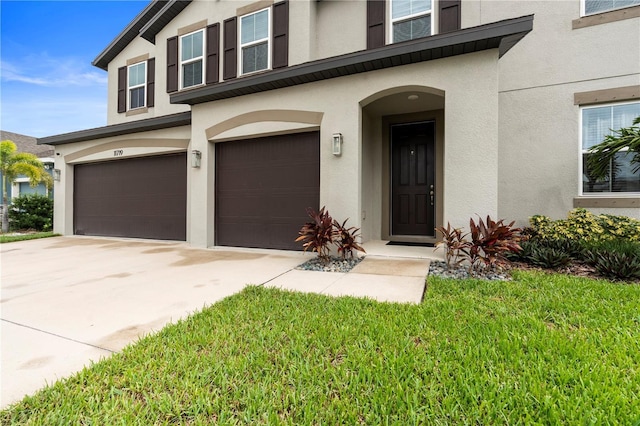 11719 Tetrafin Dr, Riverview, FL 33579 - view of front facade with stucco siding, a garage, and concrete driveway