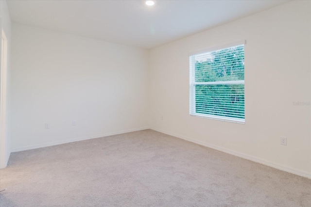 11054 Crescent Deer Dr, Land O Lakes, FL 34638 - carpeted spare room featuring baseboards