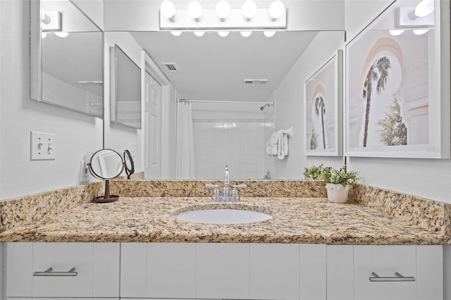 5445 Gulf Blvd Unit 210, St Pete Beach, FL 33706 - bathroom featuring vanity and curtained shower