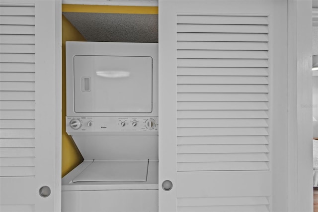 5445 Gulf Blvd Unit 210, St Pete Beach, FL 33706 - washroom featuring stacked washer and clothes dryer