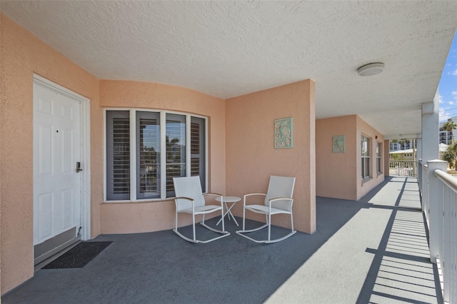 5445 Gulf Blvd Unit 210, St Pete Beach, FL 33706 - view of patio featuring a balcony