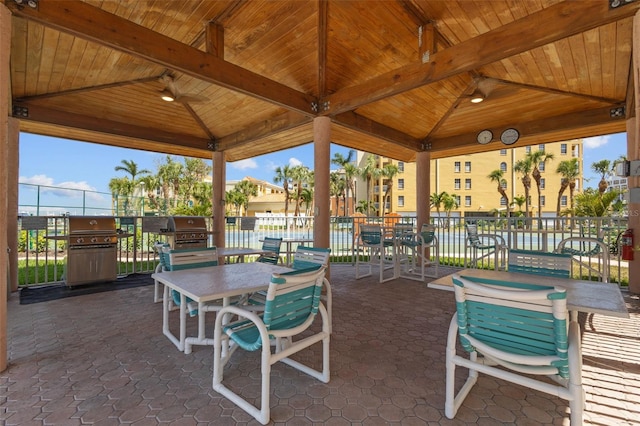 5445 Gulf Blvd Unit 210, St Pete Beach, FL 33706 - view of patio / terrace with a gazebo, grilling area, outdoor dining space, and a ceiling fan
