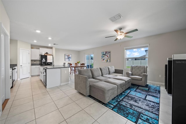 4403 Eternal Prince, Sun City Center, FL 33573 - living area featuring light tile patterned floors, recessed lighting, a ceiling fan, and baseboards