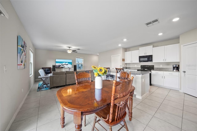 4403 Eternal Prince, Sun City Center, FL 33573 - dining space with light tile patterned floors, ceiling fan, recessed lighting, and baseboards