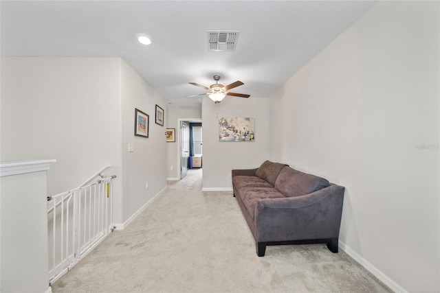 4403 Eternal Prince, Sun City Center, FL 33573 - sitting room with ceiling fan, light carpet, and baseboards