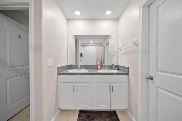 4403 Eternal Prince, Sun City Center, FL 33573 - full bath featuring double vanity, tile patterned flooring, baseboards, and a shower