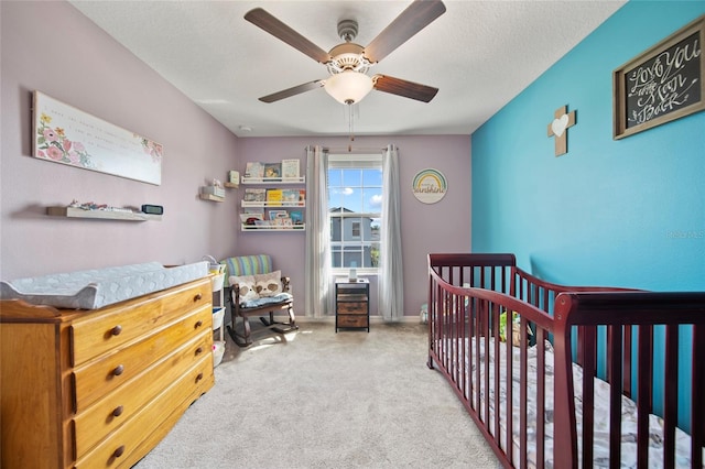 4403 Eternal Prince, Sun City Center, FL 33573 - carpeted bedroom featuring a nursery area, ceiling fan, and baseboards