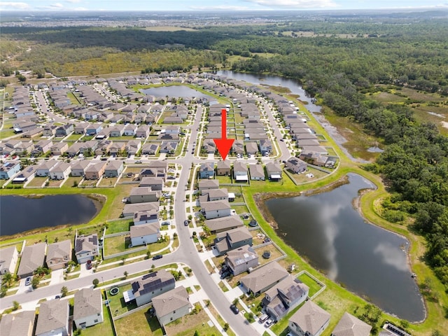 4403 Eternal Prince, Sun City Center, FL 33573 - aerial view of property's location featuring a heavily wooded area, nearby suburban area, and a nearby body of water