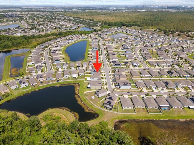 4403 Eternal Prince, Sun City Center, FL 33573 - aerial overview of property's location with nearby suburban area and a large body of water