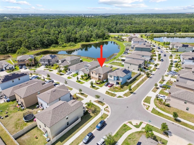 4403 Eternal Prince, Sun City Center, FL 33573 - aerial overview of property's location with a heavily wooded area and a large body of water