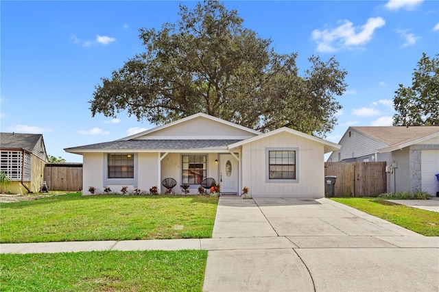 12529 Mondragon Dr, Tampa, FL 33625 - view of front of property featuring concrete driveway, covered porch, and a shingled roof