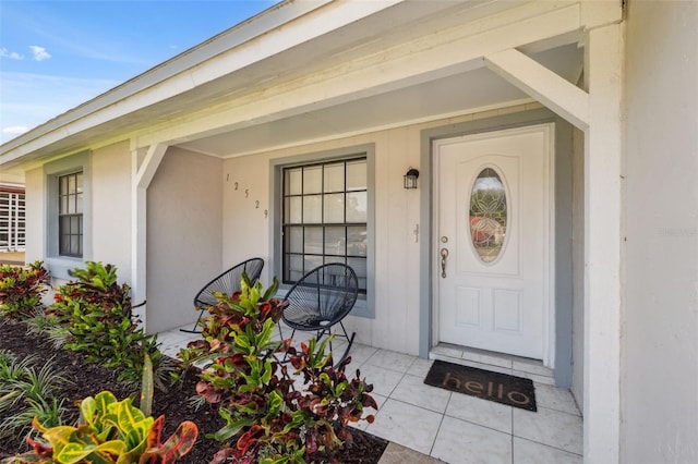 12529 Mondragon Dr, Tampa, FL 33625 - property entrance with covered porch and stucco siding