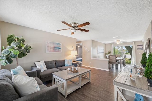 12529 Mondragon Dr, Tampa, FL 33625 - living area with ceiling fan, dark wood-style floors, a textured ceiling, and baseboards