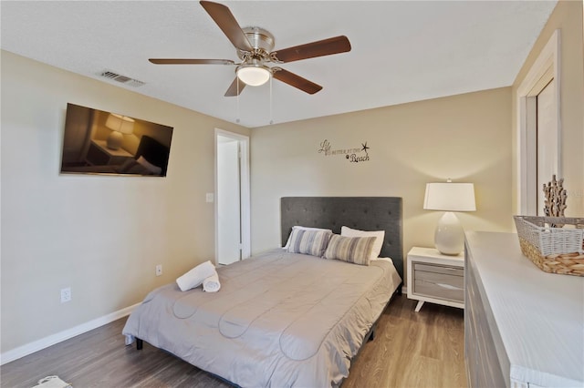 12529 Mondragon Dr, Tampa, FL 33625 - bedroom featuring wood finished floors, baseboards, and ceiling fan