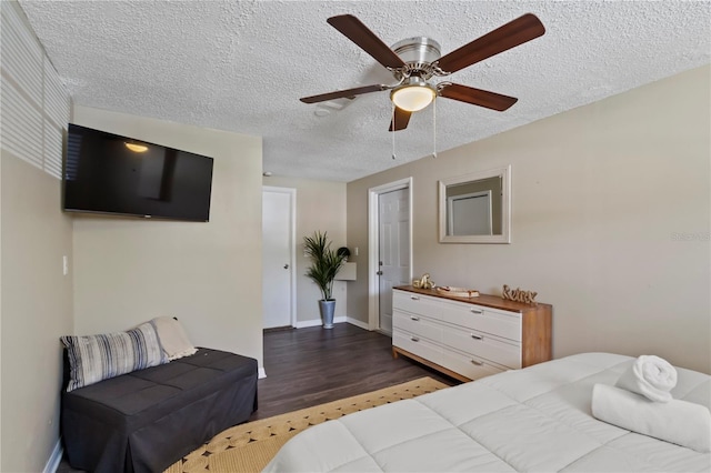 12529 Mondragon Dr, Tampa, FL 33625 - bedroom featuring wood finished floors, a textured ceiling, baseboards, and a ceiling fan