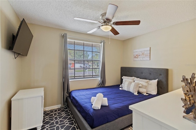 12529 Mondragon Dr, Tampa, FL 33625 - bedroom with a textured ceiling, a ceiling fan, baseboards, and carpet floors