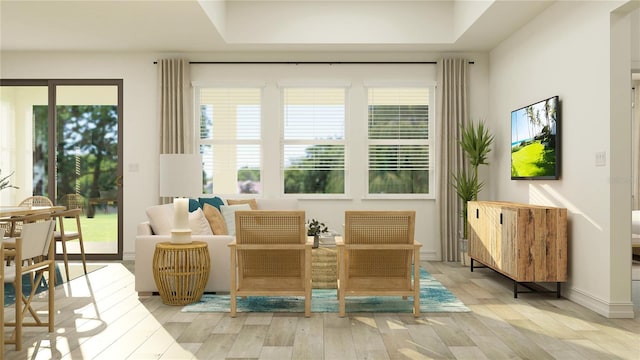 7546 E 117th Ln, Palmetto, FL 34221 - living area with light wood-style floors and healthy amount of natural light