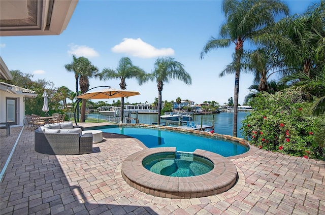 511 Island Way, Clearwater Beach, FL 33767 - view of pool with a water view, a patio, a dock, a pool with connected hot tub, and boat lift