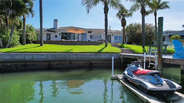 511 Island Way, Clearwater Beach, FL 33767 - dock area with a water view and a yard