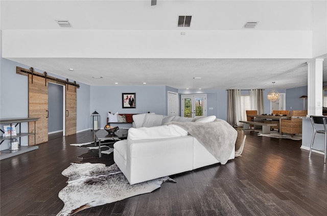 511 Island Way, Clearwater Beach, FL 33767 - living area featuring a barn door, wood finished floors, and recessed lighting