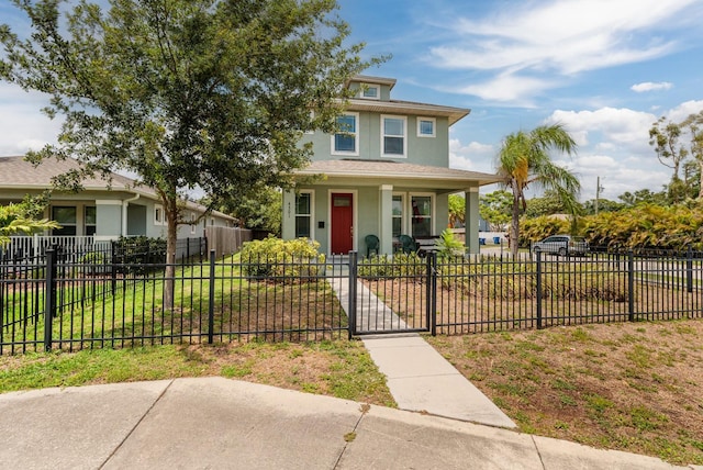 4301 5th Ave N, Saint Petersburg, FL 33713 - american foursquare style home with a porch, stucco siding, and a gate