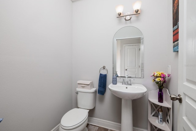 4301 5th Ave N, Saint Petersburg, FL 33713 - half bathroom with toilet and baseboards