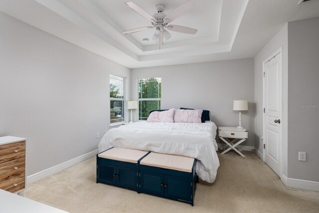 4301 5th Ave N, Saint Petersburg, FL 33713 - bedroom with light carpet, a raised ceiling, baseboards, and ceiling fan