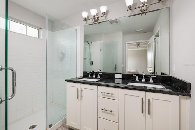 4301 5th Ave N, Saint Petersburg, FL 33713 - full bath with a stall shower, double vanity, and a chandelier