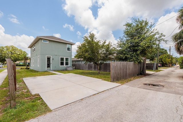4301 5th Ave N, Saint Petersburg, FL 33713 - back of property with stucco siding and a patio